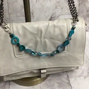 Green beaded chain bag charms.